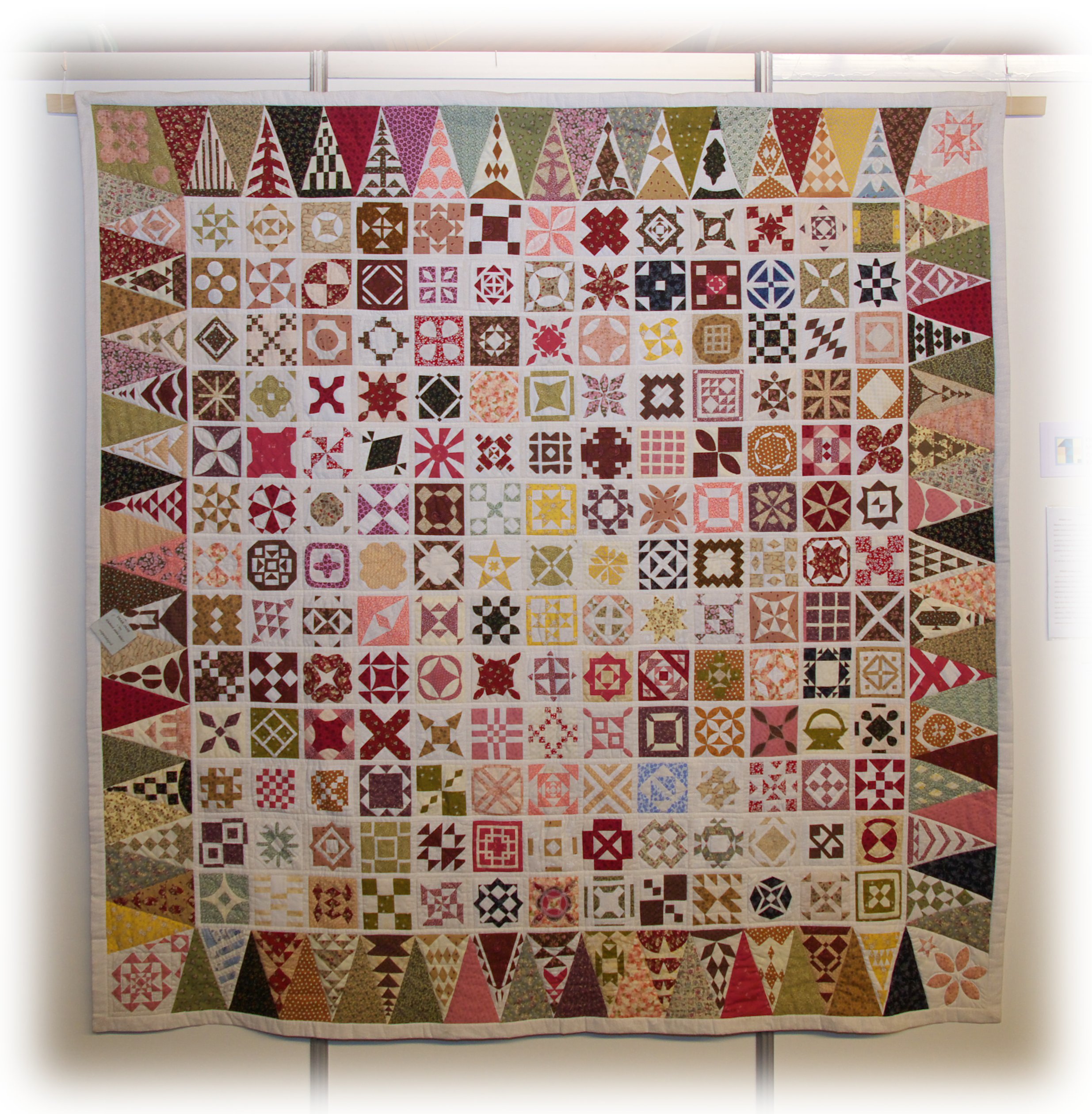 This photo shows a modern quilt created to resemble and pay tribute to the 1863 quilt created by Jane Stickle.